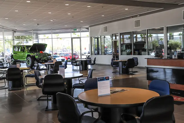 Show room and tables with vehicles on display