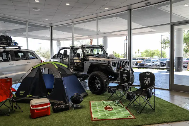 Show room with camping gear and vehicles on display